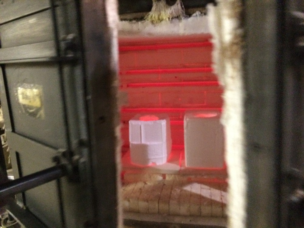 At that point the glass was all melted into the mold and we cracked the oven to "crash" it back down to the annealing temperature of 900° before the glass devitrifies.