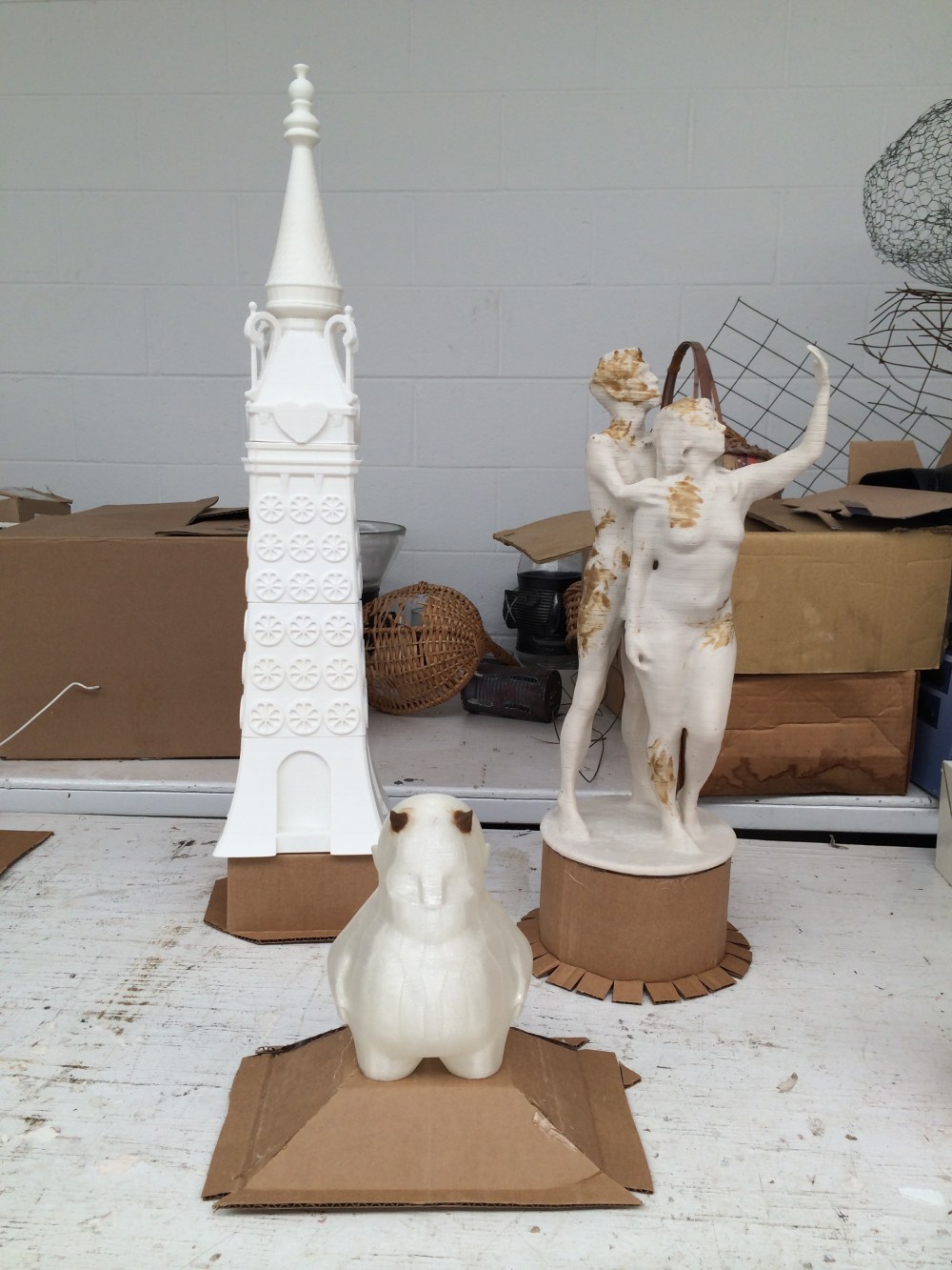 I had three 3D Printed PLA pieces to cast altogether- A 24" tall Luna Park Tower (printed in sections), Mat Fraser and Julie Atlas Muz 18" tall figure (printed on Makerbot's Z-18 printer), and the Zee figurine. I used some cardboard and hot glue to piece together a reservoir for each print before going to make a mold around each. 