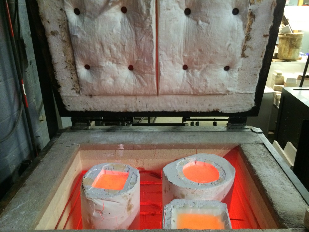 I just turned off the oven and left it open for a few minutes at a time. The goal is to let all that heat dissipate and bring it back to ~960 asap. The problem was there was so much mass in those molds.